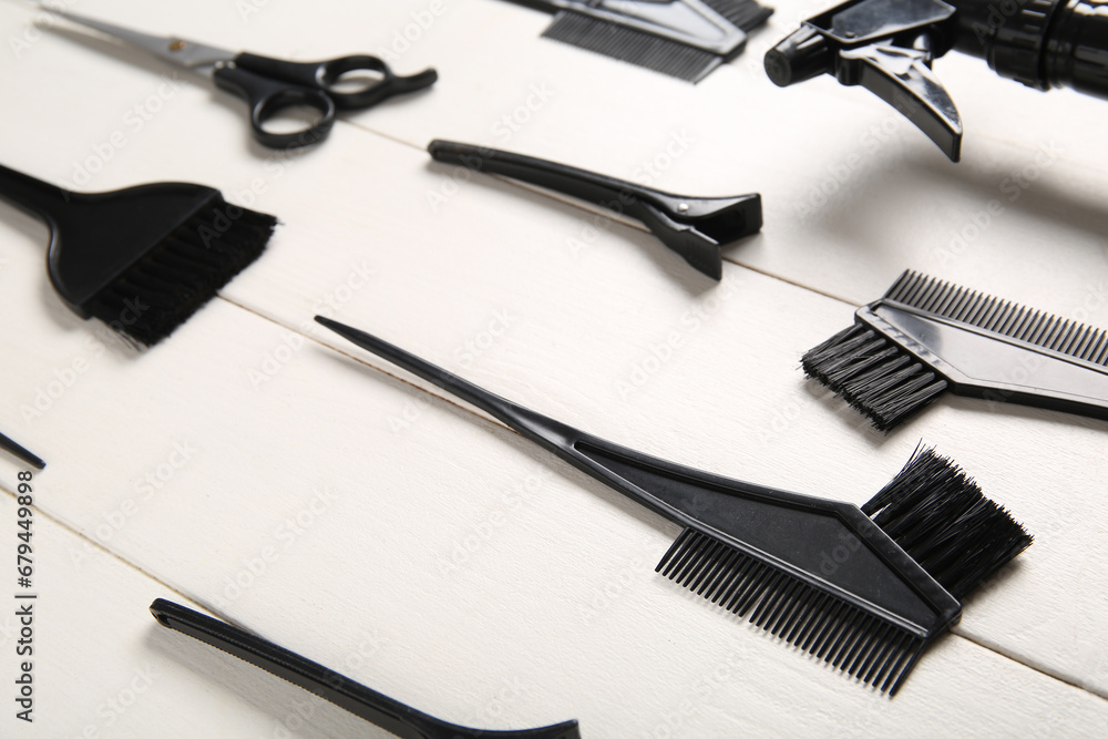 Set of hairdresser's tools on white wooden background Set of hairdresser's tools on white wooden background