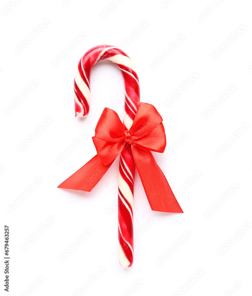 Christmas candy cane with bow on white background Christmas candy cane with bow on white background