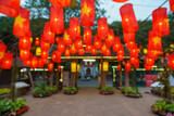 Defocused red lanterns hanging on street. Oriental festive style background