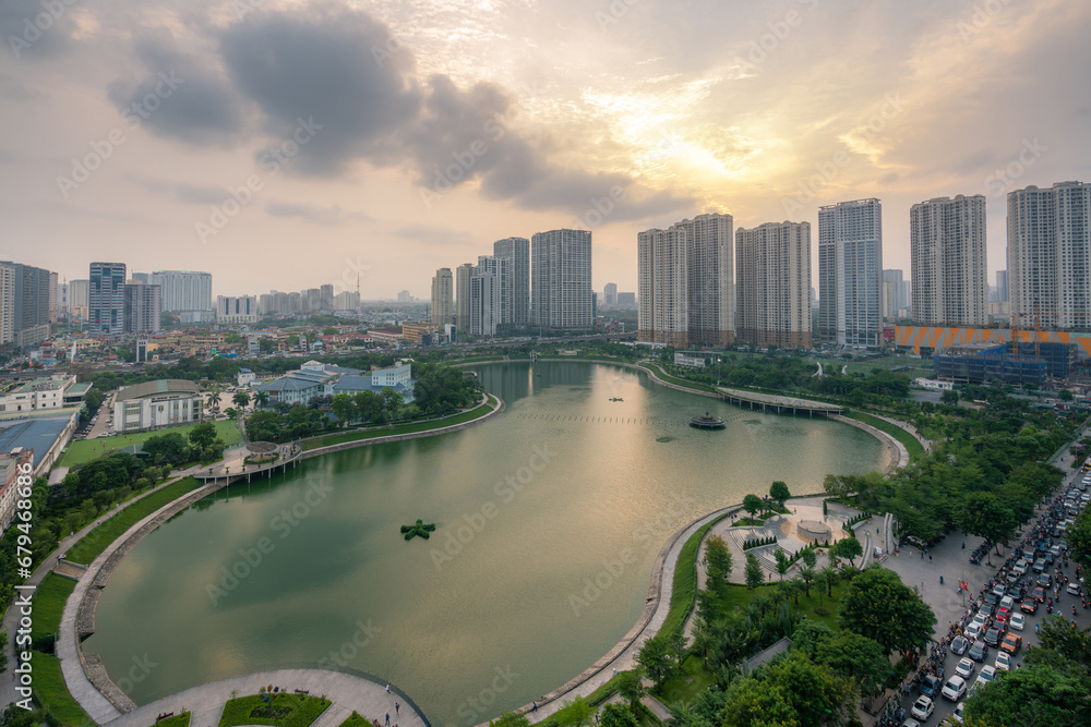 Fototapeta premium Cityscape of Hanoi skyline at Thanh Xuan park during sunset time in Hanoi city, Vietnam