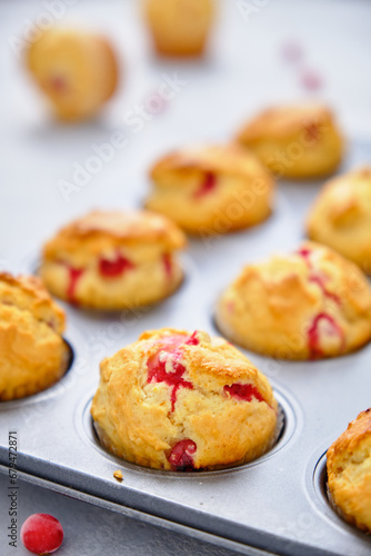 Muffins with red currants in the form for baking © Tereza
