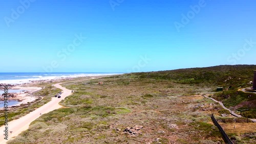 Aerial view of red and white Cape Agulhas lighthouse at southernmost tip of Africa