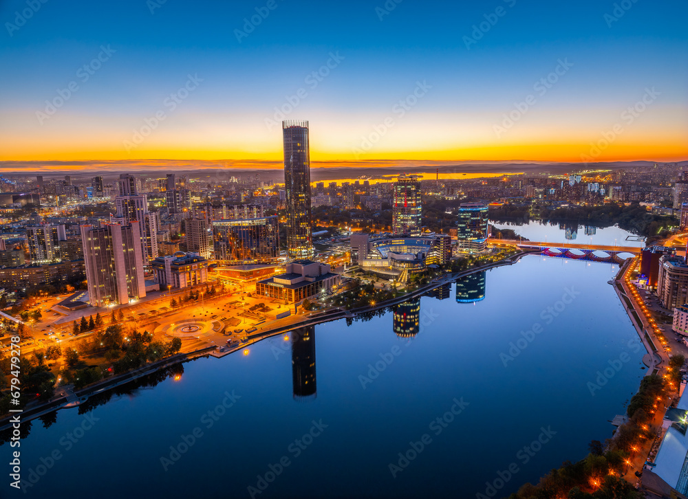 Yekaterinburg city and pond aerial panoramic view at summer or early autumn night. Night city in the early autumn or summer.