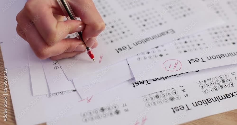 Closeup of female hands marking exam test A Closeup of female hands marking exam test A