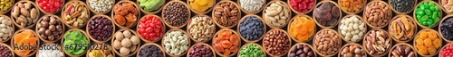 assorted nuts and dried fruit. long panoramic food background. photo