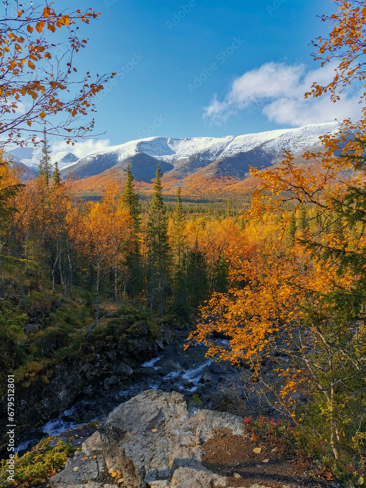 Autumn Arctic landscape in the Khibiny mountains. Kirovsk, Kola Peninsula, Polar Russia. Autumn colorful forest in the Arctic, Mountain hikes and adventures. Autumn Arctic landscape in the Khibiny mountains. Kirovsk, Kola Peninsula, Polar Russia. Autumn colorful forest in the Arctic, Mountain hikes and adventures.