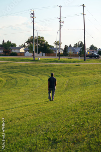 man walking on the grass © Victor