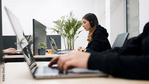 In Big Diverse Corporate Office: Portrait of Beautiful Asian Manager Using Desktop Computer, Businesswoman Managing Company Operations, Analysing Statistics, Commerce Data, Marketing Plans.