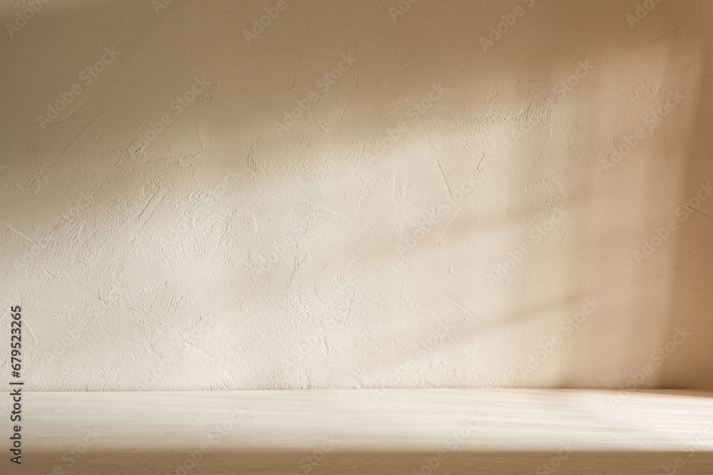 Background for product presentation. Empty room with wooden floor, textured stone wall and light from the window Background for product presentation. Empty room with wooden floor, textured stone wall and light from the window