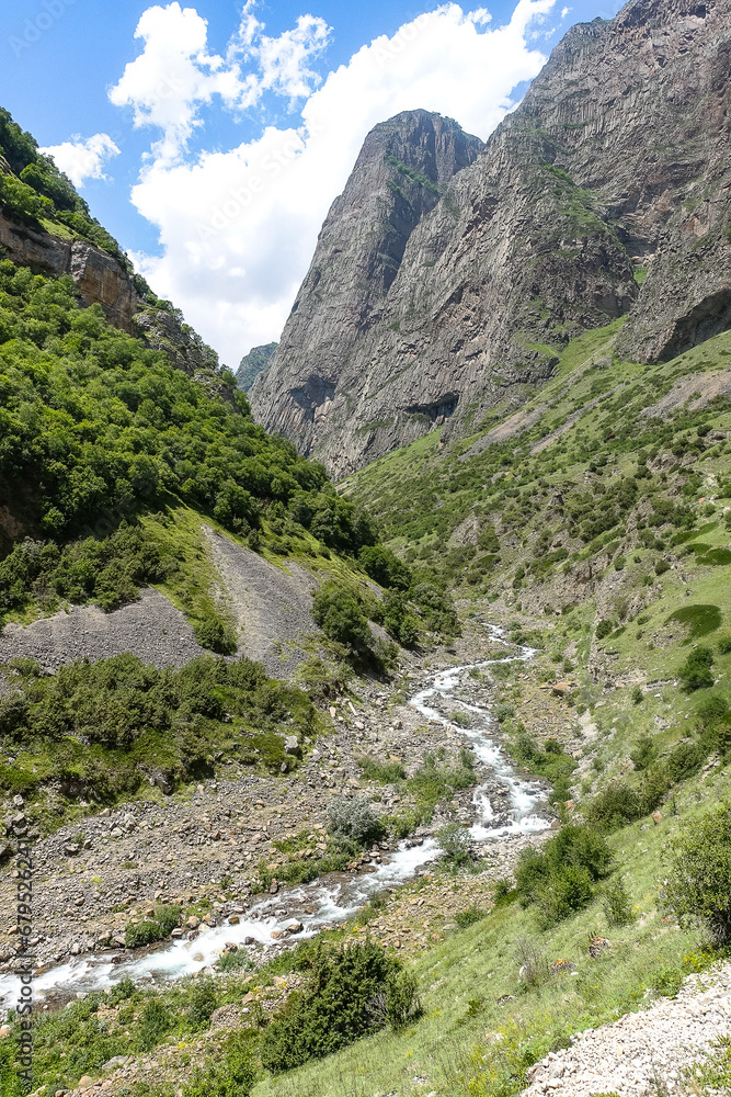 The picturesque gorge of the Jylgy-su river. The Caucasus Mountains near the ancient city of Eltuby. Next to the grotto with an ancient human parking lot.