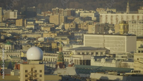 Panorama of the Moscow Kremlin and the Cathedral of Christ the Saviour. Close-up of rooftops of buildings in central Moscow on a bright summer day. Shot on hands