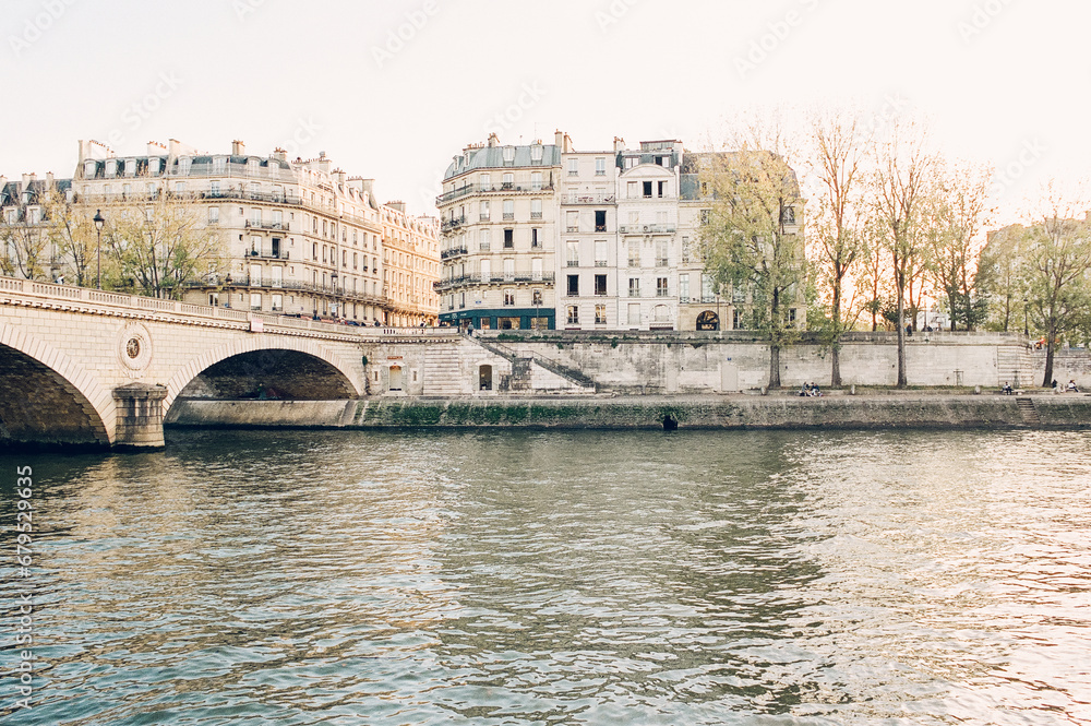 Fototapeta premium dreamy view of Paris lit up with golden light along the seine