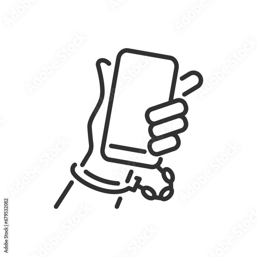 Smartphone addiction, linear icon. The smartphone is handcuffed to the hand. Line with editable stroke