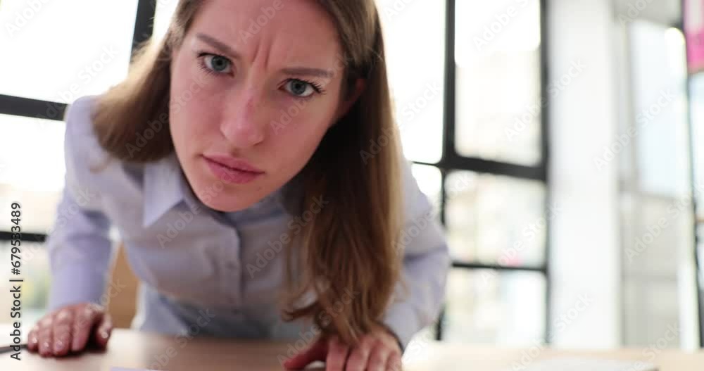 Closeup sad angry serious woman face portrait looking at camera Closeup sad angry serious woman face portrait looking at camera