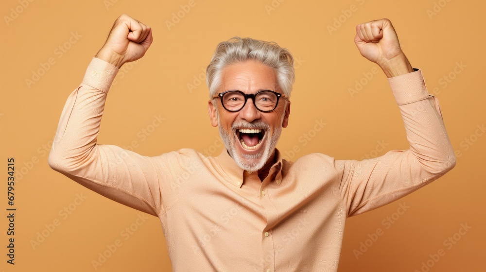 Fototapeta premium hooray elder grey hairdo man indicate empty space wear spectacles shirt isolated on beige color background, joyful, cheerful, adult, achievement, retirement, happy