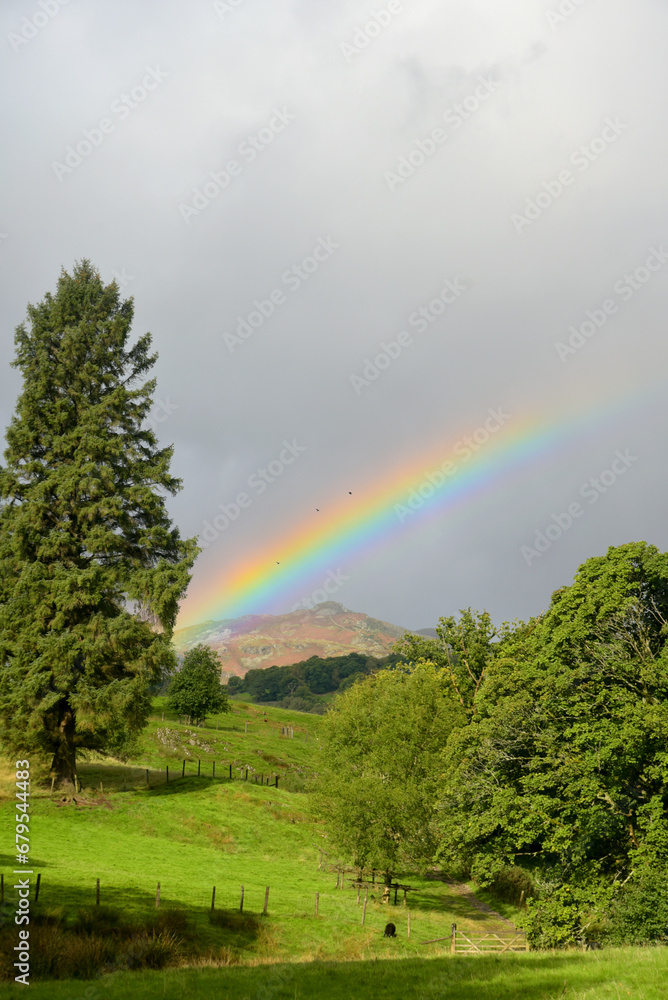 A rainbow shining above the valley of Little Langdale, near Skelwith Bridge in the Lake District
