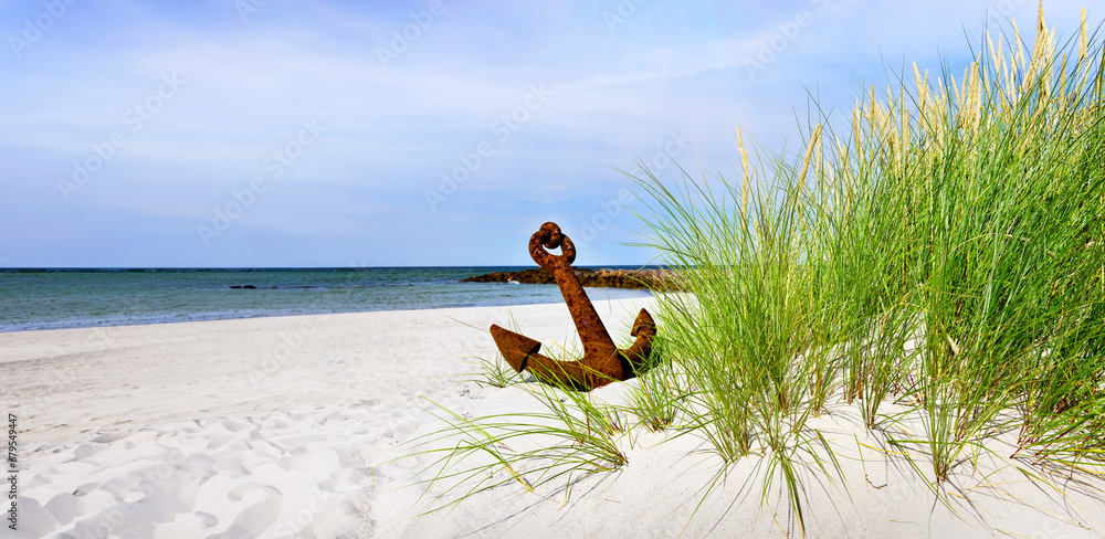 Baltic Sea Beach with rusty Anchor - Panorama with Sun and cloudy Sky