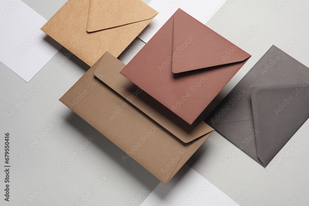 Floating envelopes and cards on gray background with shadow. Minimalism, modern business still life, creative layout Floating envelopes and cards on gray background with shadow. Minimalism, modern business still life, creative layout