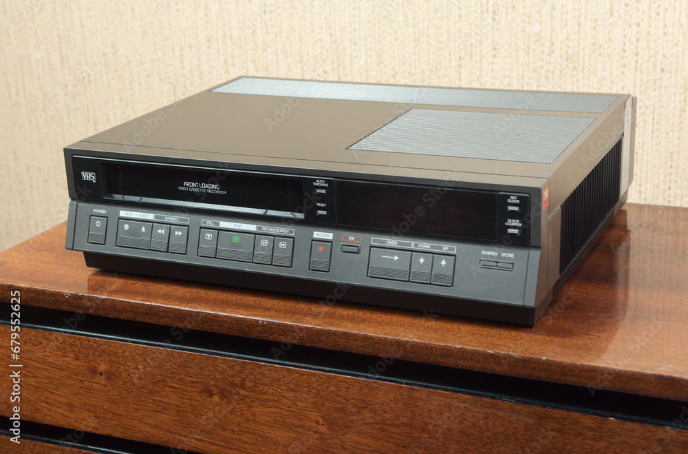 Fototapeta premium An old vintage VCR from the 1980s sits on the nightstand.