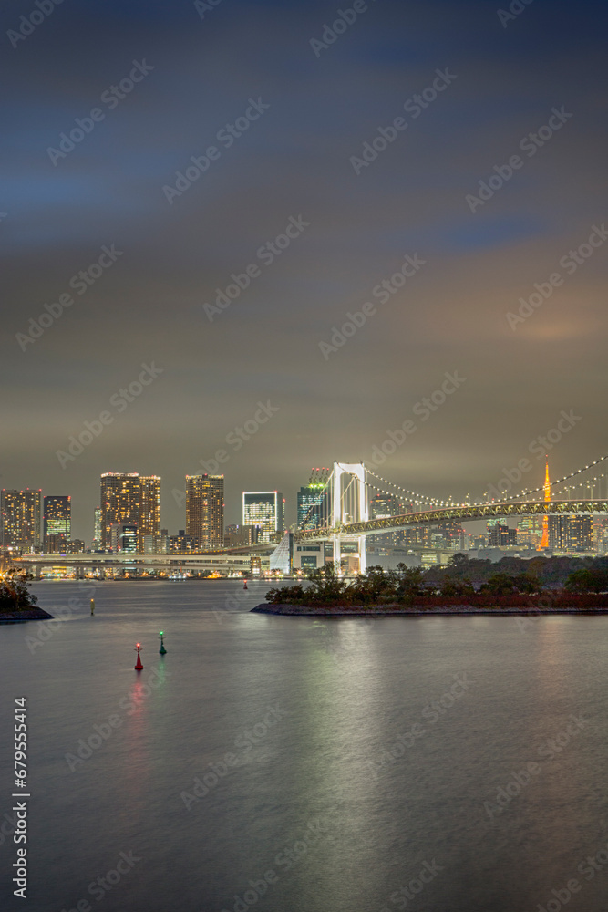 Japan Travel Destinations. Closeup View of Rainbow Bridge in Odaiba Island in Tokyo At Twilight with Line of Skyscrapers