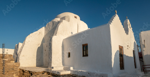 Traditional ancient whitewashed churches and houses in the waterfront of Chora  Mykonos island  Cyclades Islands  Aegean Sea  Greece