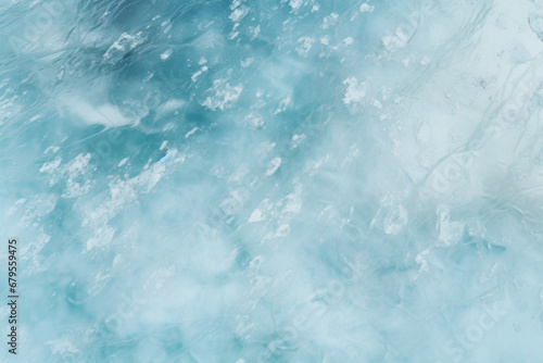 Abstract background of ice and cracks on the surface of frozen lake. View from above