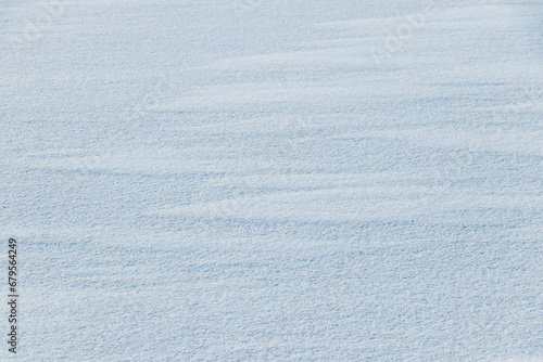 Snow texture. White surface of snow with clearly defined texture © Volodymyr