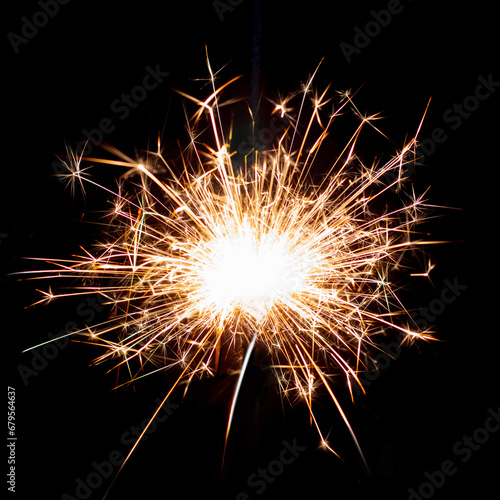 Sparklers on black isolated background. Sparks from a burning sparkler. To insert an image in a blend mode