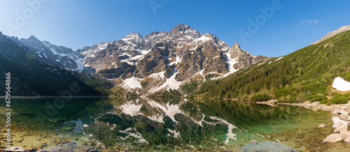 Fototapeta Naklejka Na Ścianę i Meble -  Tatra National Park in Poland. Famous mountains lake Morskie oko or sea eye lake In High Tatras. Five lakes valley