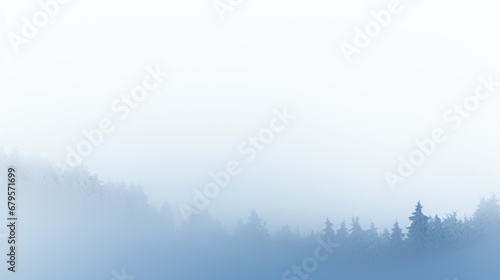 A minimalist winter landscape with fog-enshrouded trees, providing a tranquil background setting