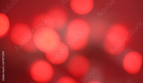 Blurred Christmas lights background with colorful red holiday bokeh