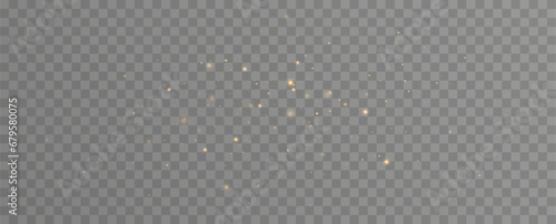 Golden sequins glow with many lights. Glittering dust. Luxurious background of golden particles.