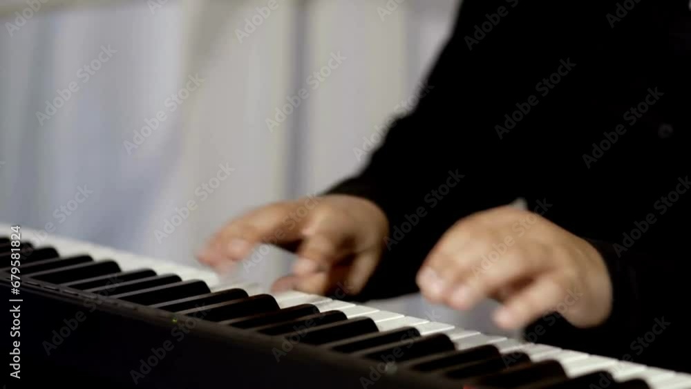Closed up of a female hand playing piano in slow motion HD DOLLY: Pianist's Closed up of a female hand playing piano in slow motion HD DOLLY: Pianist's