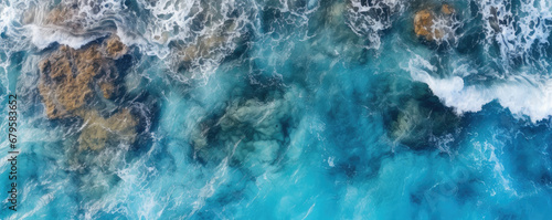 Sea waves or ocean surface from aerial view. Blue water with foam, copy space for text. photo