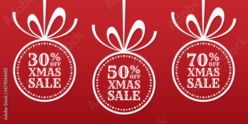 Xmas sale banner with 30, 50, 70 percent price off label, icon or tag. Christmas ball with bow and ribbon. Winter holiday promotion card design. Vector illustration.