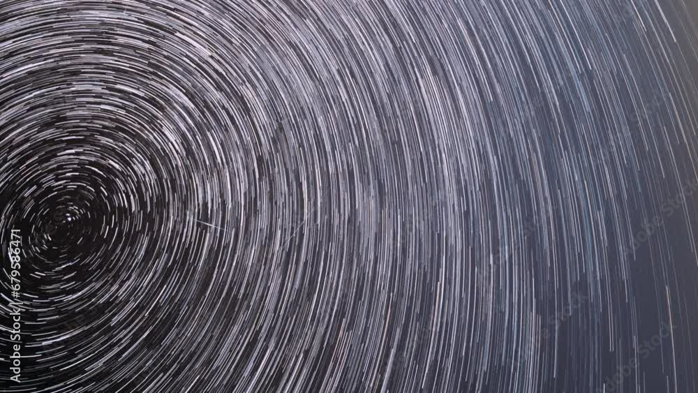 Spin Of Stars In Sky. Stars Rotate Of Sky Background. Track Trails. Spin Trails Of Stars. Large Exposure. Amazing Stars Effects In Sky. Star Trails On Night Sky Background. Time Lapse, Timelapse, Time Spin Of Stars In Sky. Stars Rotate Of Sky Background. Track Trails. Spin Trails Of Stars. Large Exposure. Amazing Stars Effects In Sky. Star Trails On Night Sky Background. Time Lapse, Timelapse, Time