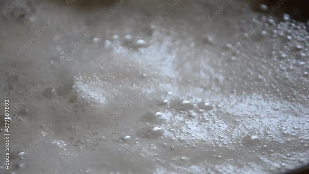 Pasta (penne) in boiling water, close up dolly shot clip Pasta (penne) in boiling water, close up dolly shot clip