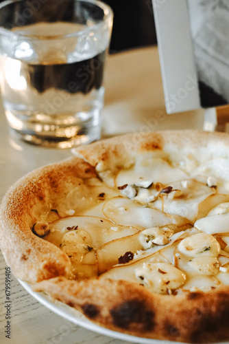 delicious pizza with gorgonzola and pear on a plate
