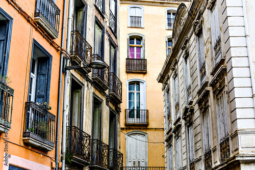 View of a street with typical buildings in Perpignan, France