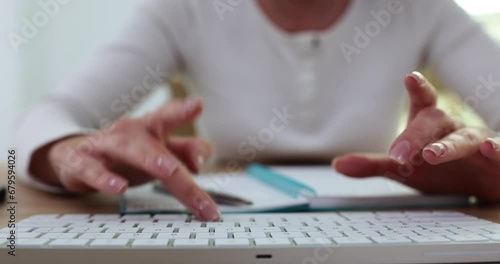 Hands of a business woman entrepreneur or journalist working on laptop computer photo