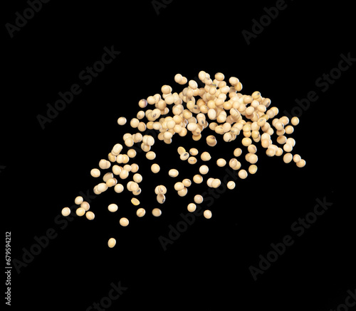 Soy Bean flying explosion, yellow grain beans explode abstract cloud fly. Beautiful complete seed pea soy bean splash in air, food object design. Selective focus freeze shot black background isolated