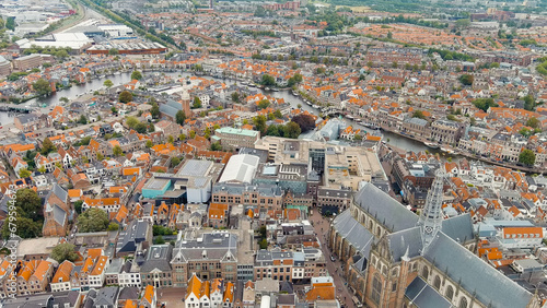 Haarlem, Netherlands. The Church of St. Bavo is a Gothic temple. Panoramic view of Haarlem city center. Cloudy weather during the day. Summer, Aerial View photo