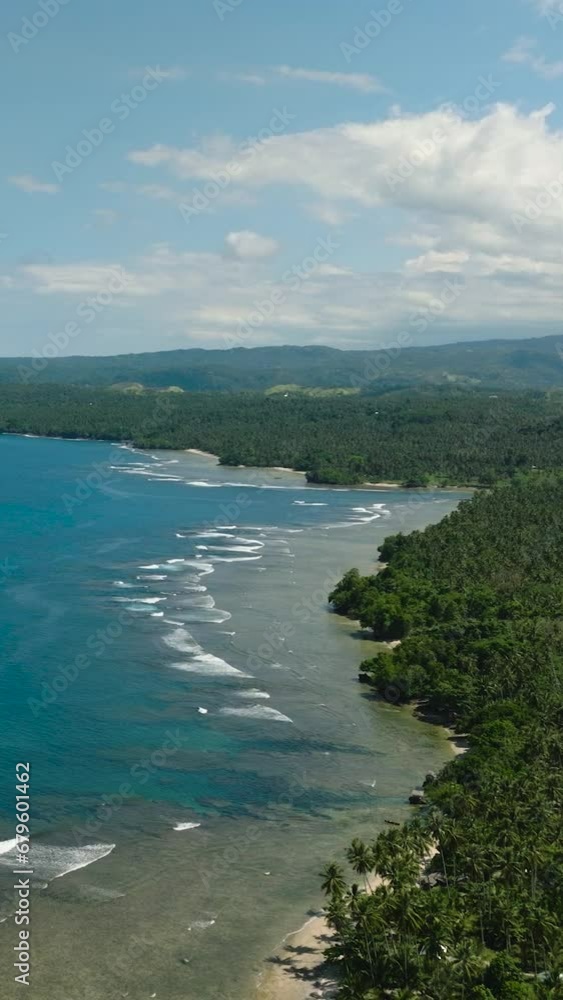 Vertical view of beautiful blue sea with waves at coast. Blue sky and clouds. Mindanao, Philippines. Seascape. Vertical view of beautiful blue sea with waves at coast. Blue sky and clouds. Mindanao, Philippines. Seascape.