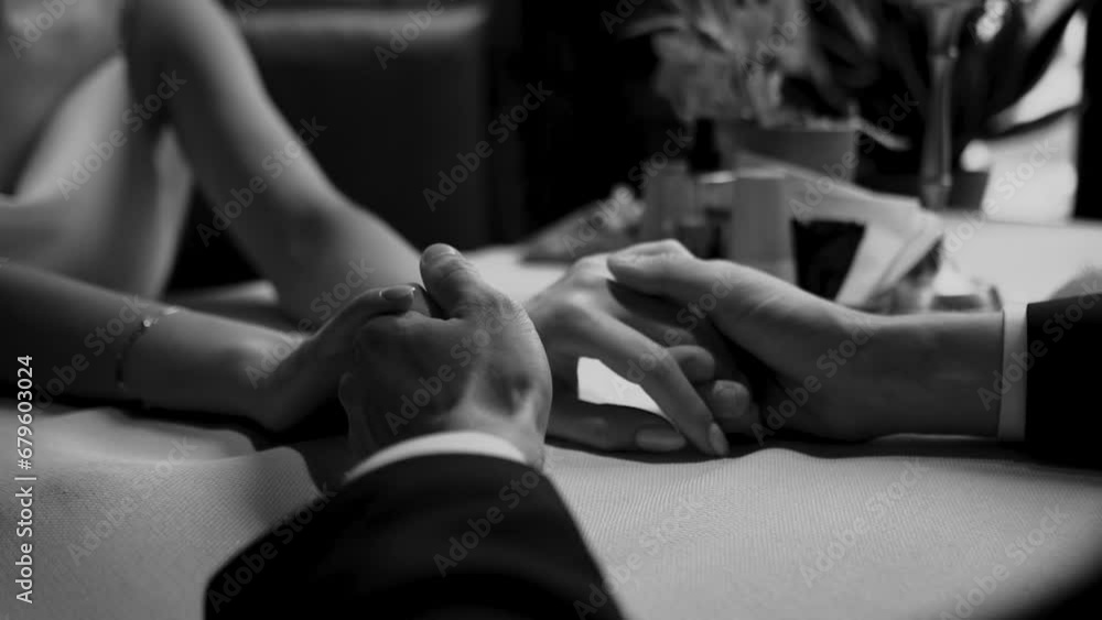 handsome groom businessman in a jacket touches his hands close-up to the bride in a white dress during a wedding walk, wedding day, details handsome groom businessman in a jacket touches his hands close-up to the bride in a white dress during a wedding walk, wedding day, details