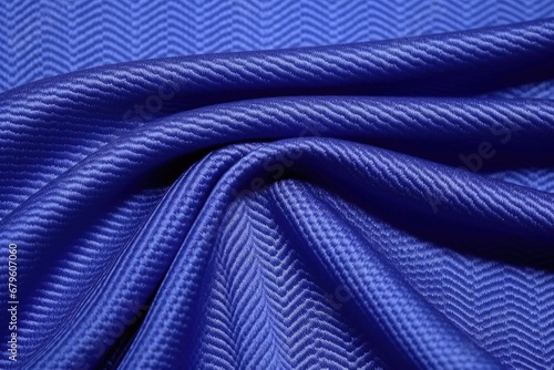 macro detail of textured twill fabric in royal blue color