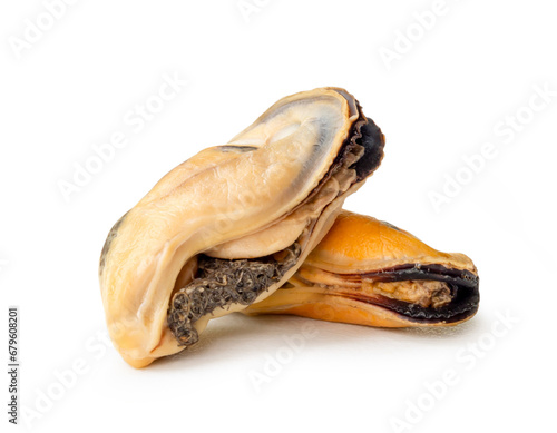 Steamed or cooked food of fresh beautiful green mussels in stack or cross shape without shells isolated on white background with clipping path