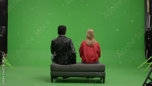 GREEN SCREEN Multi-racial couple pretending they are visiting a museum or art exhibition  (ID: 679615427)