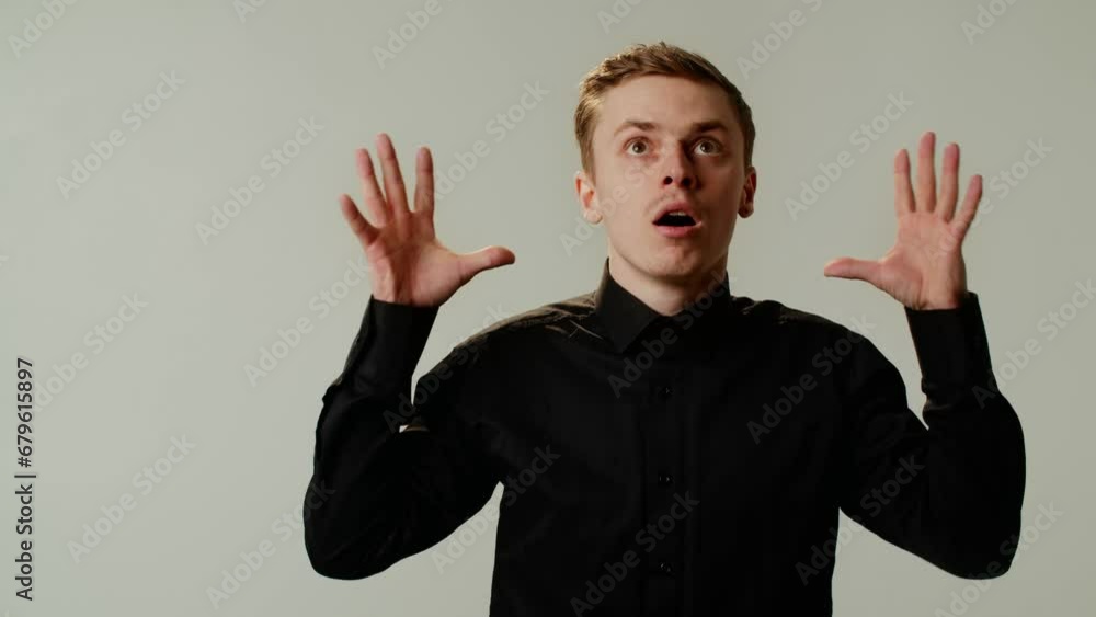 A guy student is experiencing a brain explosion from emotional overload or burnout at college and university. A young businessman is tired after busy day with lots of negotiations. Looks up at the A guy student is experiencing a brain explosion from emotional overload or burnout at college and university. A young businessman is tired after busy day with lots of negotiations. Looks up at the