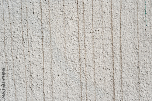 Popcorn ceiling texture gray, with dark stripes,