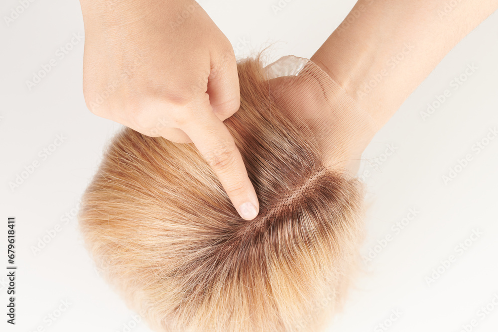 Naklejka premium Natural looking blonde wig close-up details, natural hair, extension system